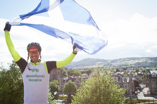 Allen Boardman -  cyclist in T-shirt w Flag