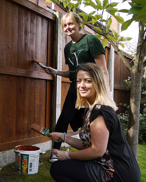 Staff from Barclays in Wavertree, Liverpool help Woodlands Hospice by painting their fences